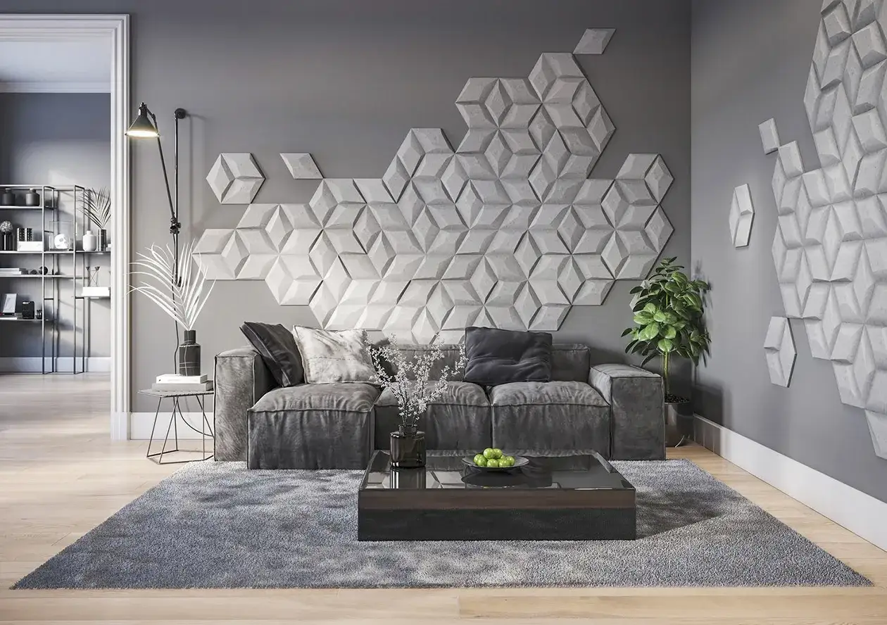 Nowoczesne rysunki na ścianę wzory 3D tworzą geometryczną mozaikę nad szarą sofą.